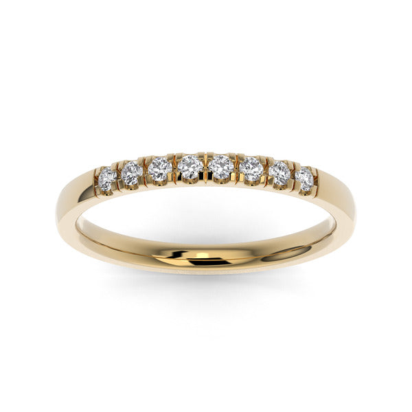Gold wedding band with diamond accent on a white background.