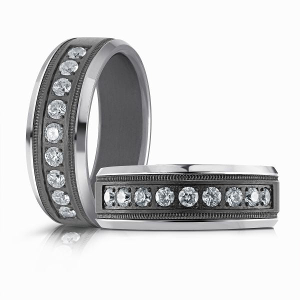 Titanium wedding band with a black carbon fiber inlay and diamond accents on a white background.