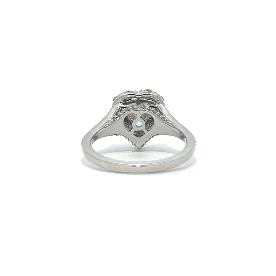 Silver heart-shaped diamond engagement ring with a halo setting and split shank on a white background.