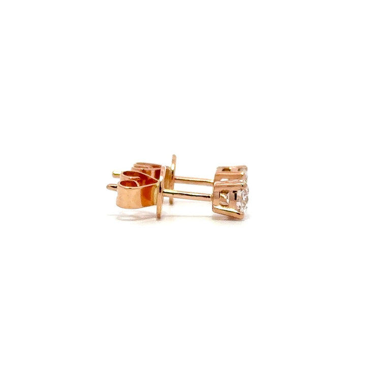 Rose gold stud earrings with a single diamond in each setting, on a white background.