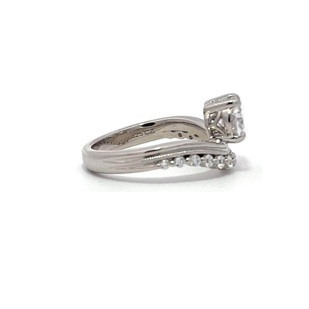 White gold diamond engagement ring set with a matching wedding band on a white background.