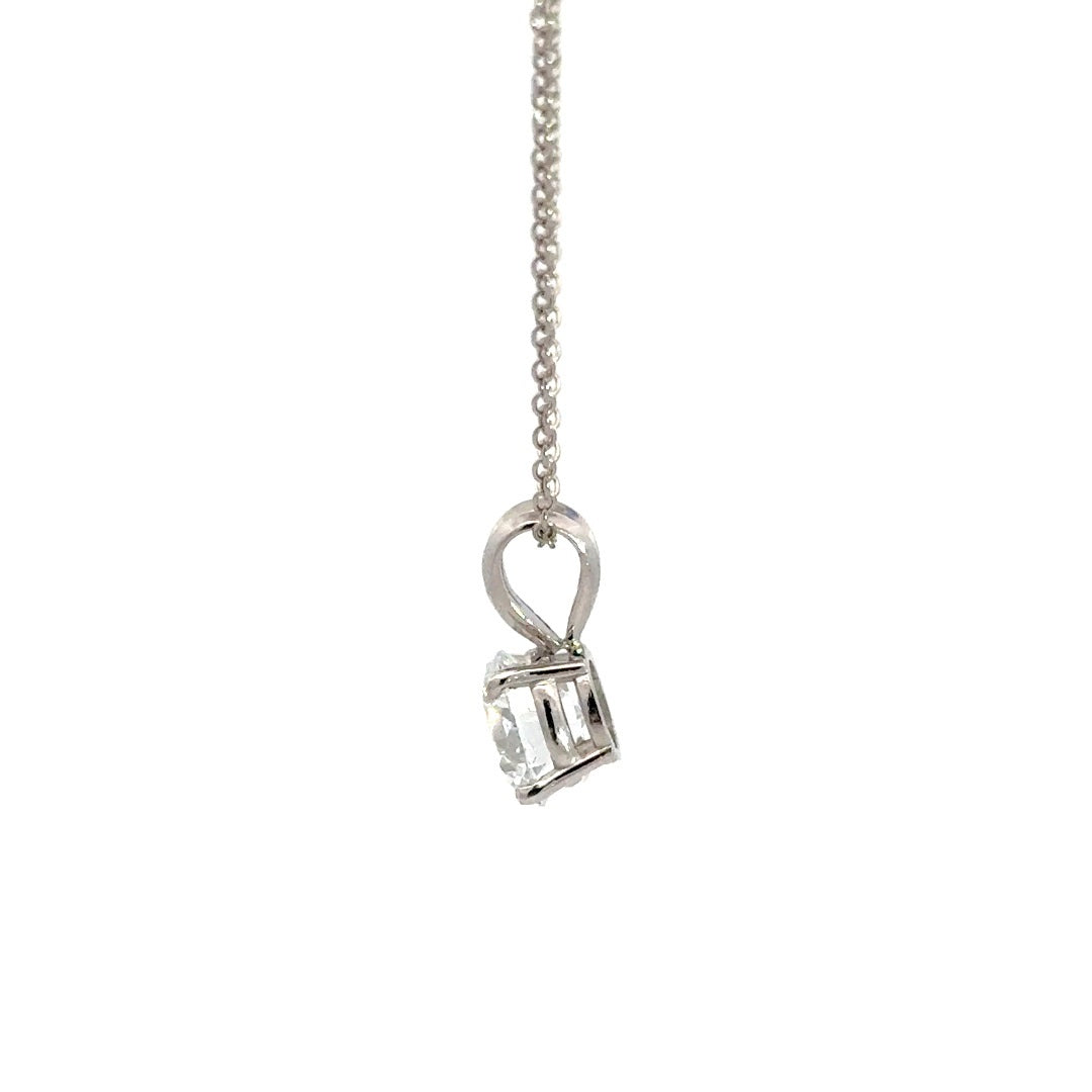 Silver necklace with round cut diamond pendant on a white background