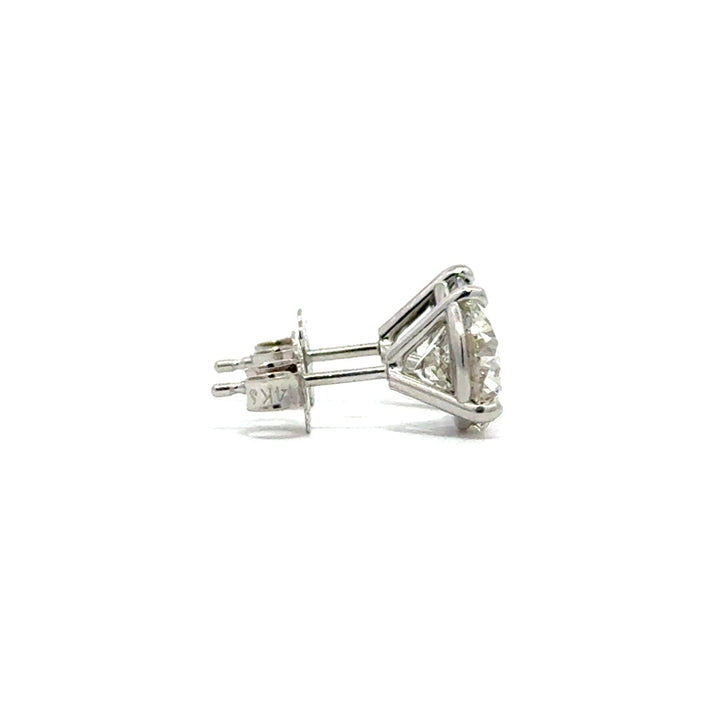 Side view of silver stud earrings in a white background