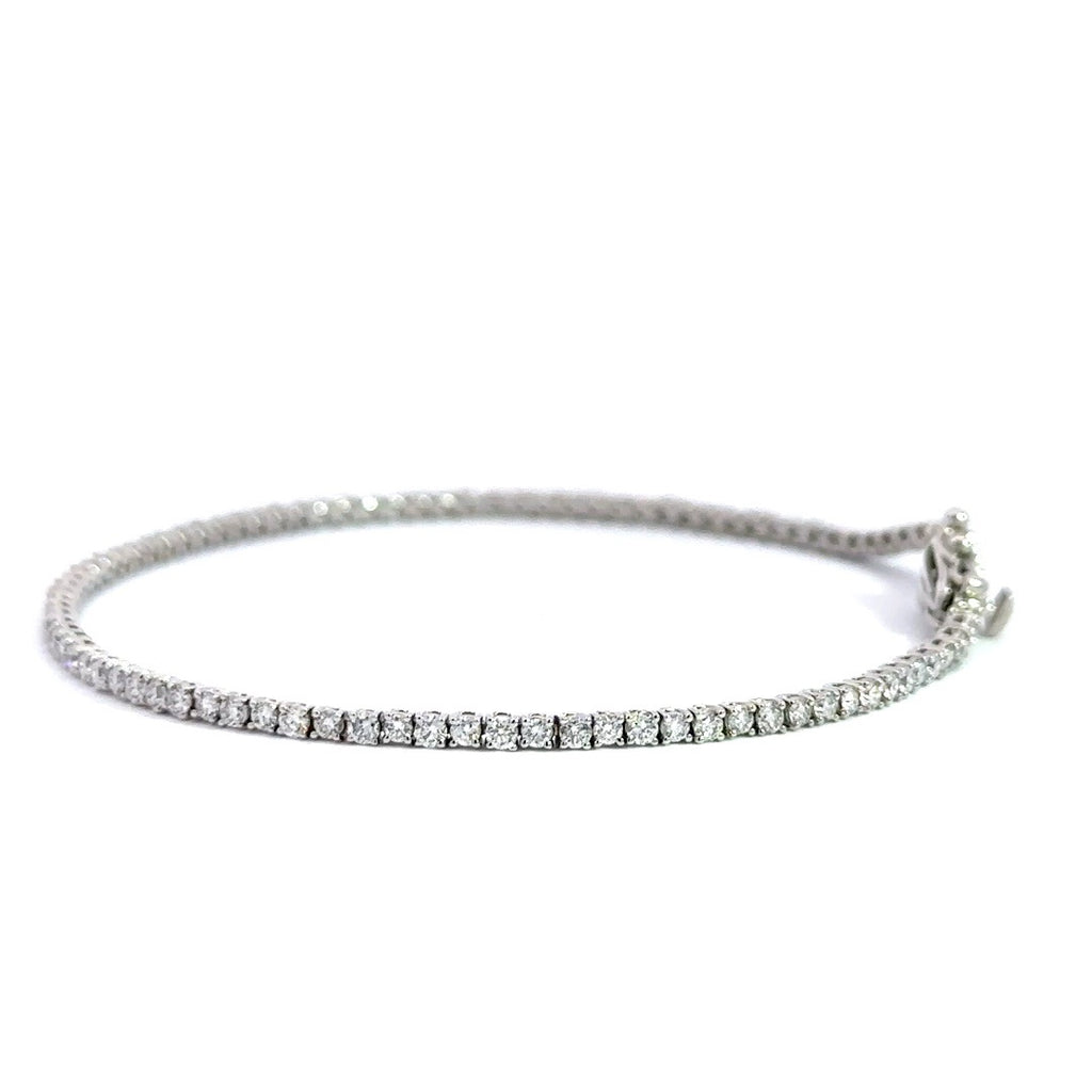 Silver diamond tennis bracelet on a white background.