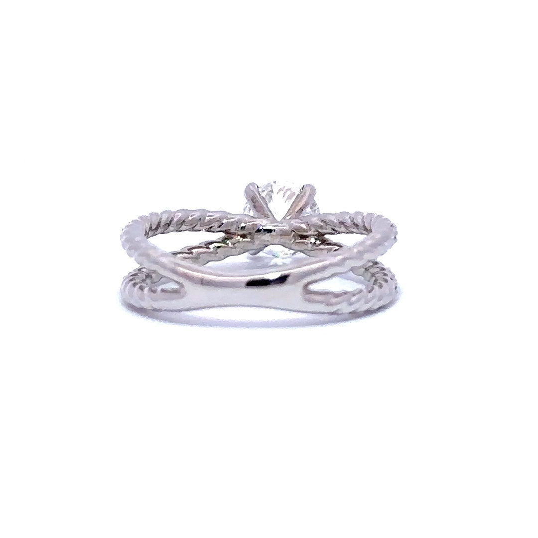 Silver engagement  ring with a round-cut diamond center stone and two split diamond bands, on a white background.