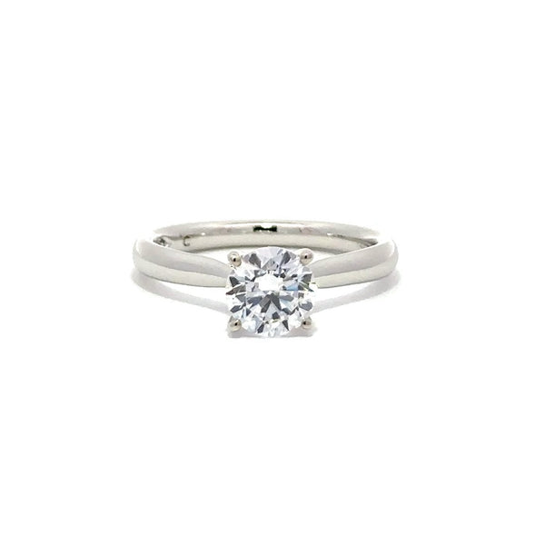 Front view of silver engagement ring with a round-cut center diamond.