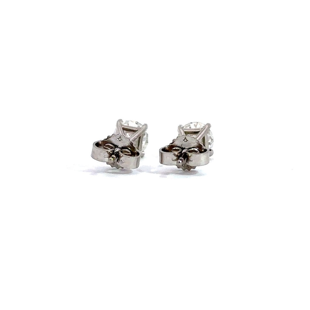 Back view of silver stud earrings in a white background