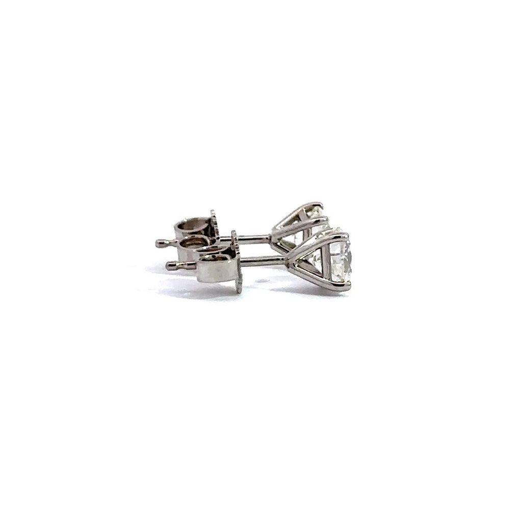 Side view of silver stud earrings in a white background