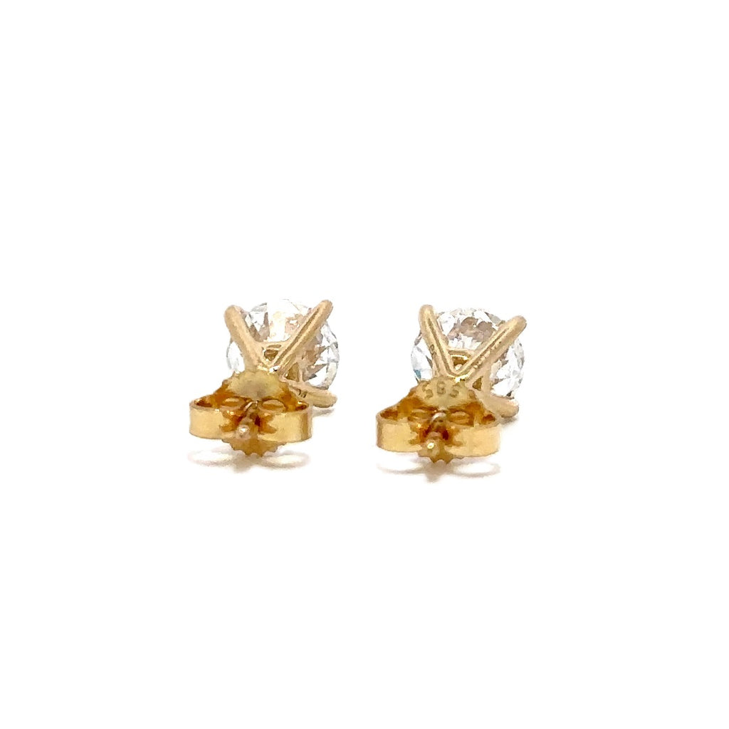 Pair of yellow gold stud earrings with a triangular setting of diamonds on a white background.