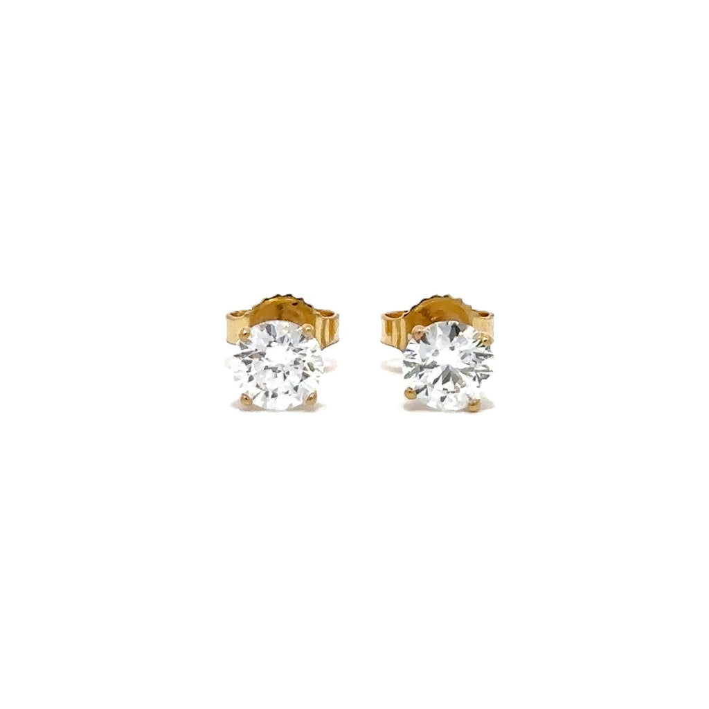 Pair of yellow gold stud earrings with a triangular setting of diamonds on a white background.