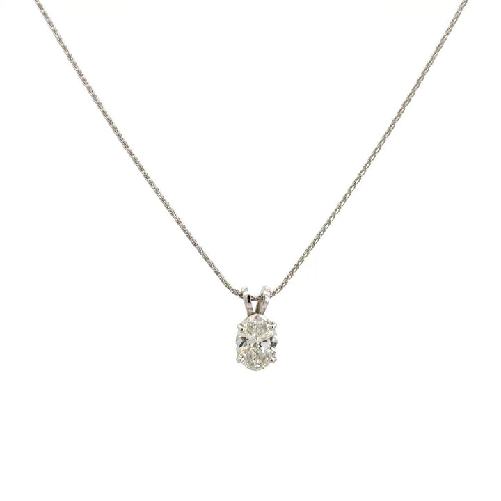 Front view of silver necklace with a oval-cut diamond in a four-prong setting pendant on a white background.