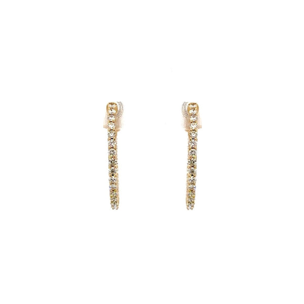 Pair of gold diamond earrings on a white background