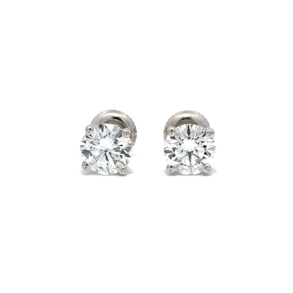 Front view of pair of silver stud diamond earrings on a white background