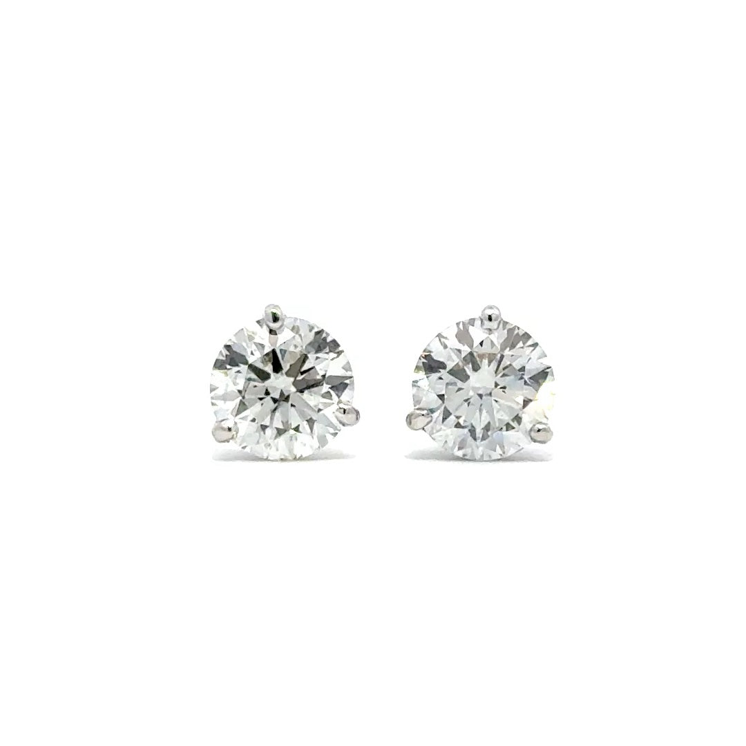 Front view of diamond silver stud earrings on white background