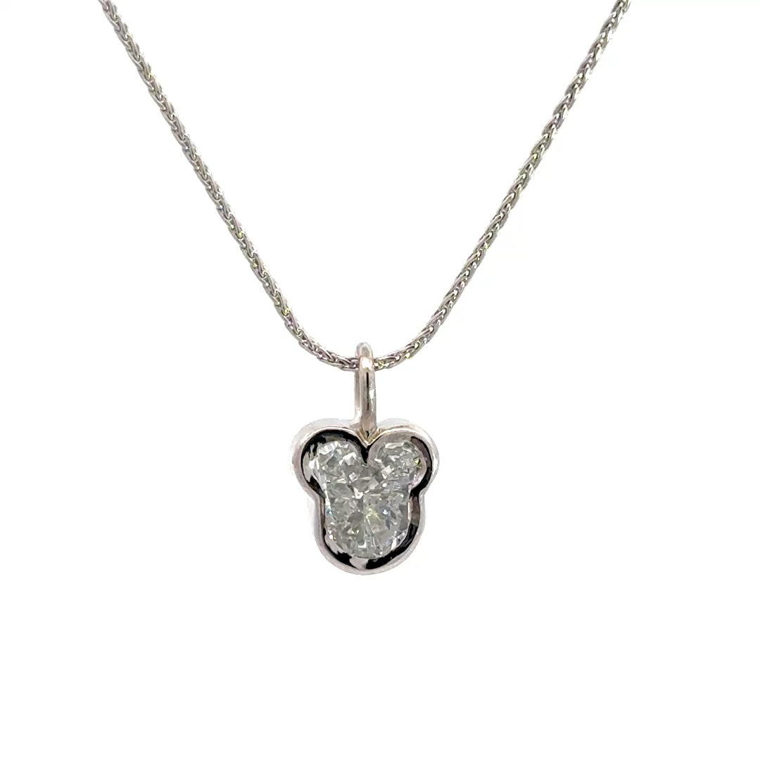 Silver necklace with a diamond pendant shaped like a Mickey Mouse head  in a bezel setting