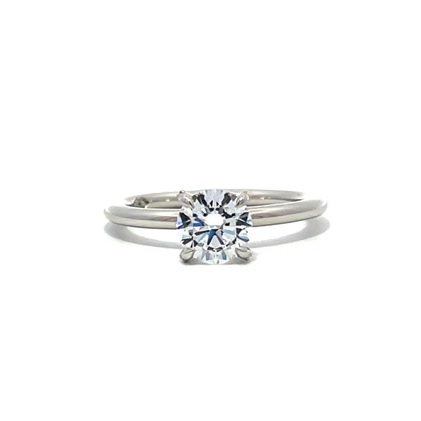 White gold diamond solitaire engagement ring on a white background.