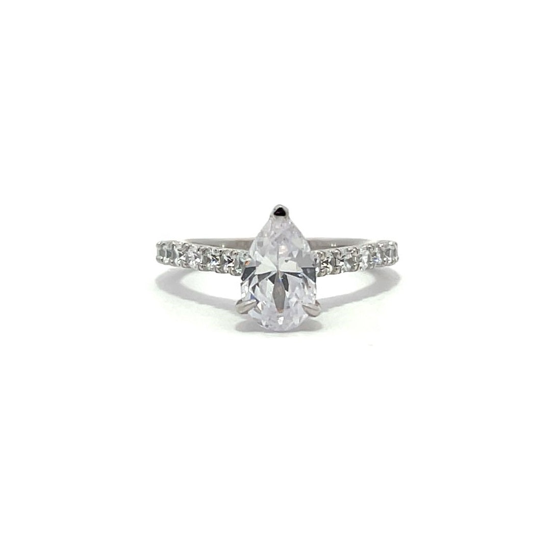 White gold pear-shaped diamond engagement ring with a diamond band on a white background.