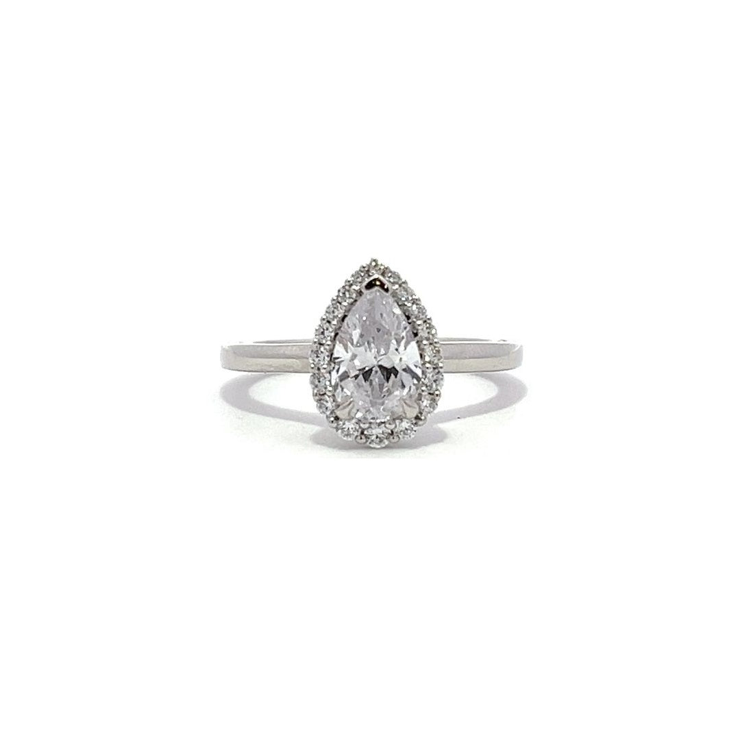 White gold pear-shaped diamond engagement ring with a halo setting on a white background