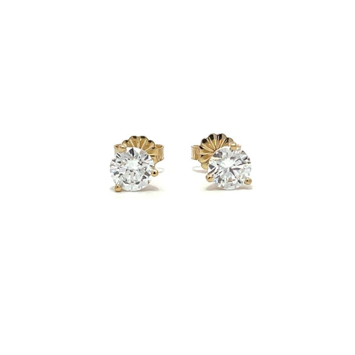 Yellow gold stud earrings with round diamonds on a white background.