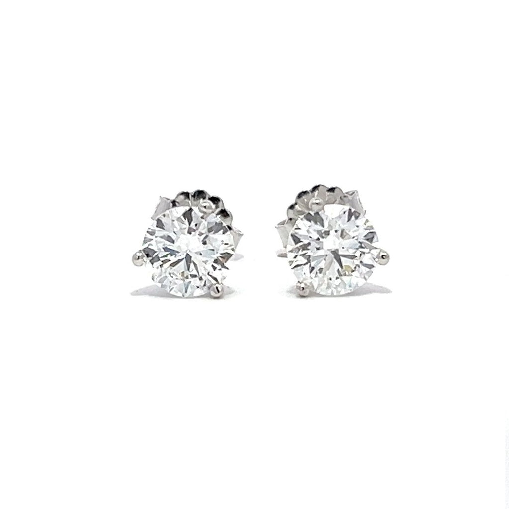 White gold stud earrings with round diamonds on a white background.