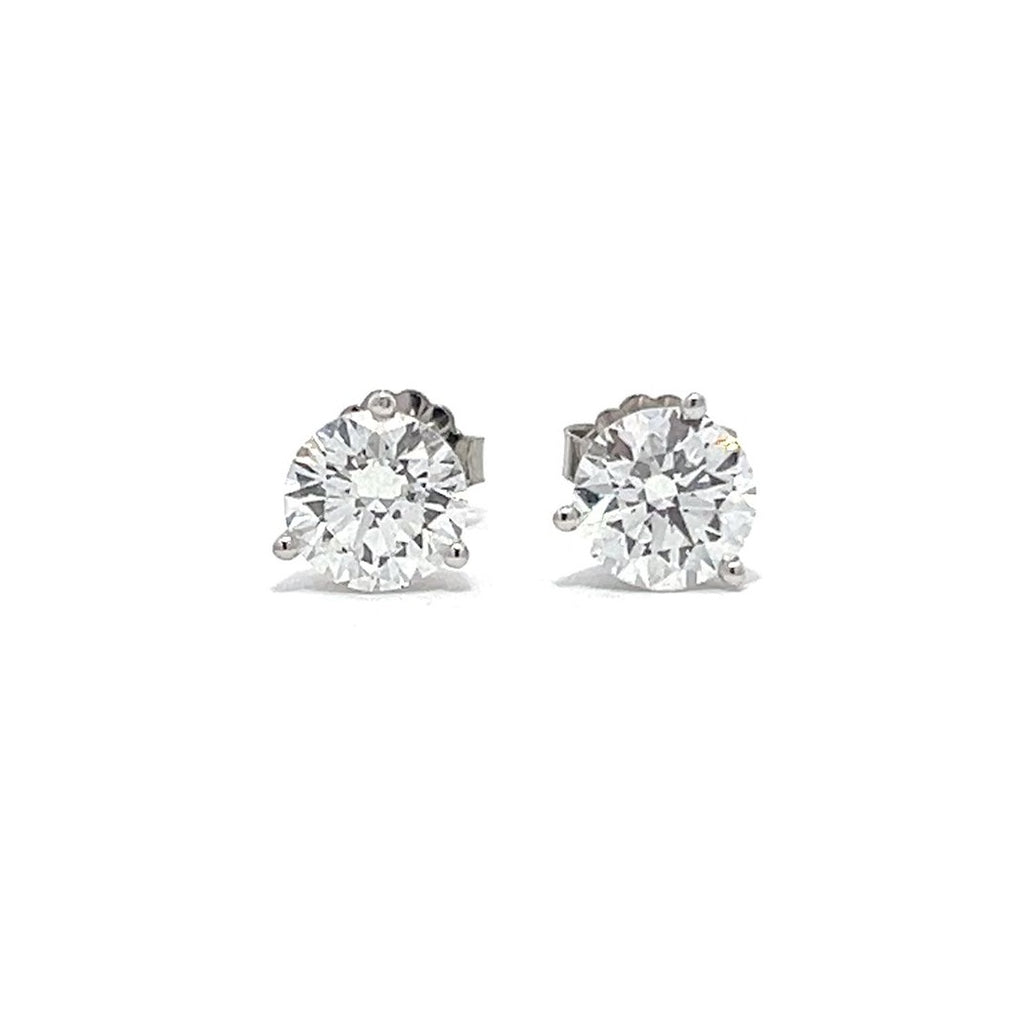 White gold stud earrings with round diamonds on a white background.