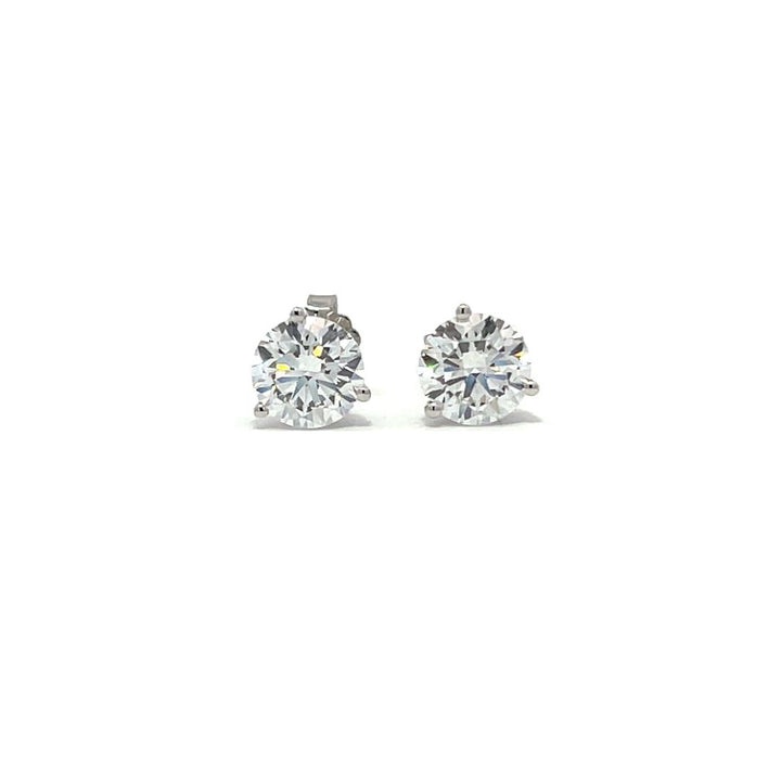 White gold stud earrings with round diamonds on a white background.