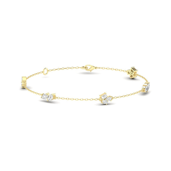 Yellow gold station bracelet with multiple diamond clusters, on a white background.