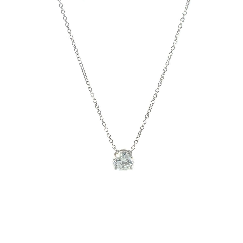 Silver necklace with a round diamond solitaire pendant on a white background.