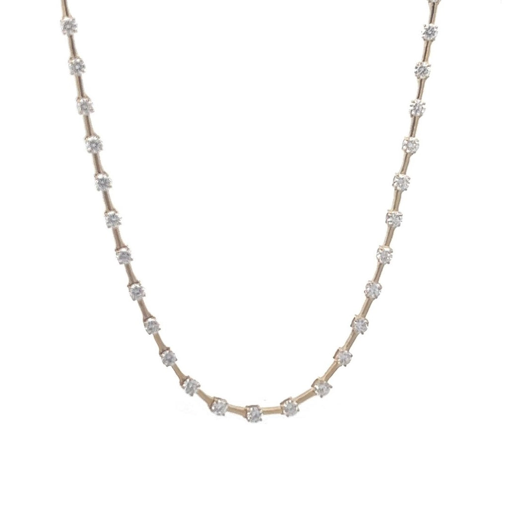 Yellow gold necklace with a row of round diamonds on a white background.