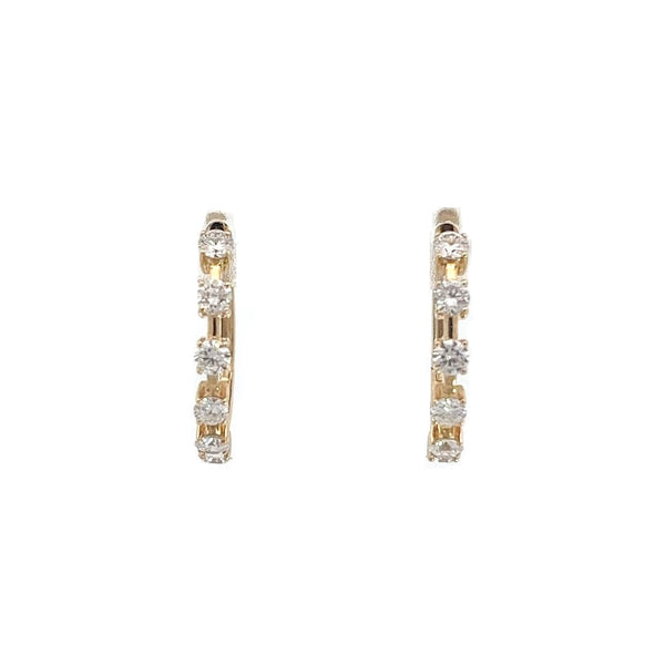 Yellow gold hoop earrings with five diamond accents on a white background.