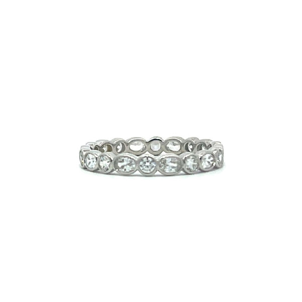 Silver eternity ring with oval stones on a white background