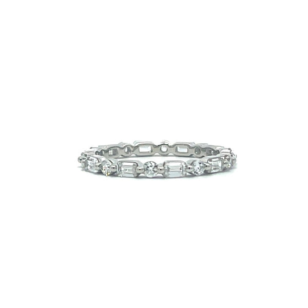 Silver eternity ring with round and baguette stones on a white background