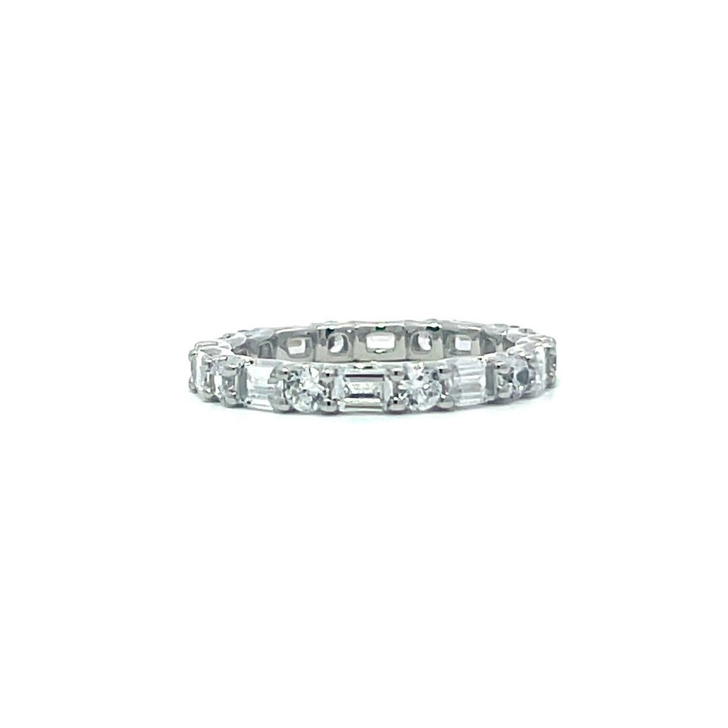 Silver eternity ring with baguette stones on a white background.