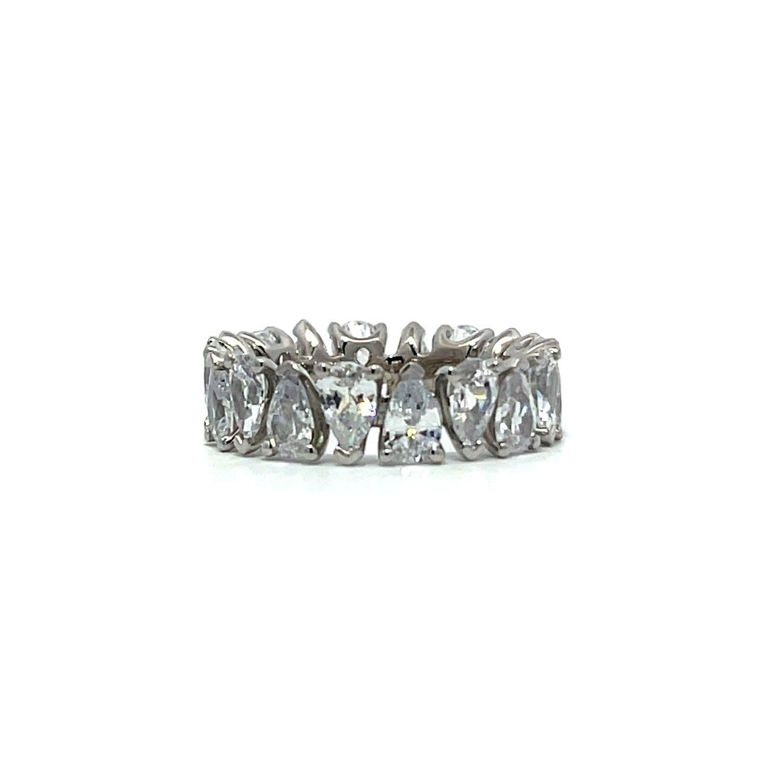 Silver pear-shaped stone eternity ring on a white background