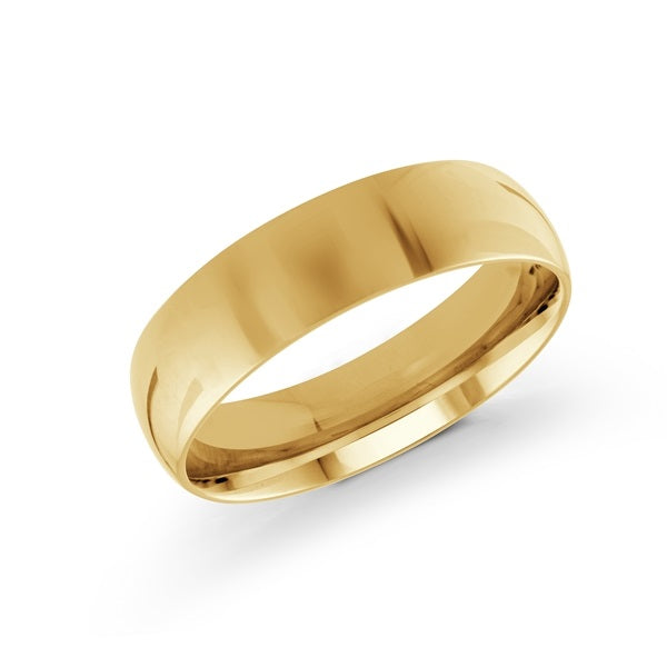 Gold wedding band on a white background.