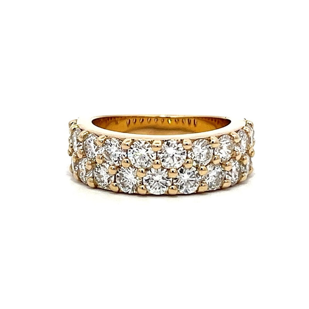 Yellow gold eternity band with two rows of pave-set diamonds on a white background.