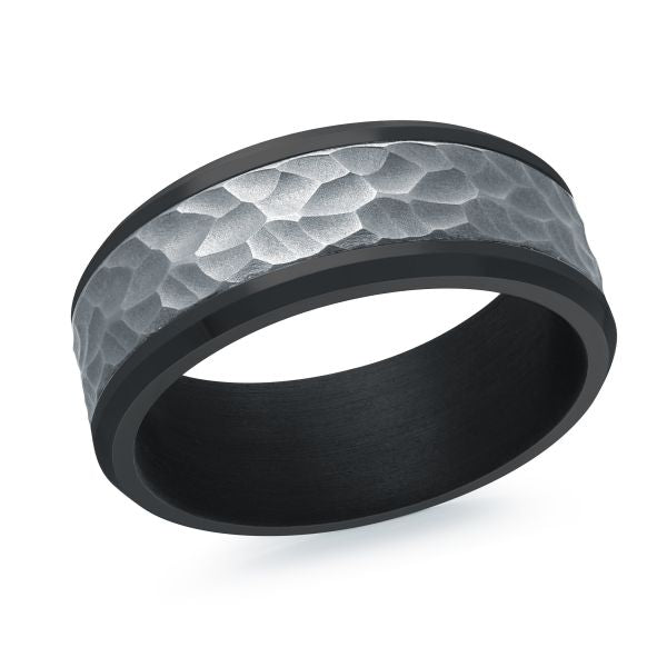 Black titanium ring with a hammered silver center on a white background.