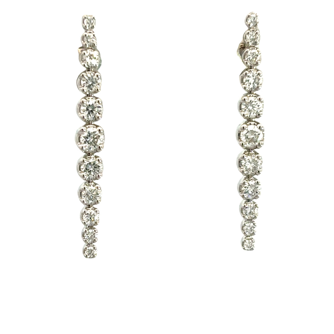 Diamond drop earrings on a white background