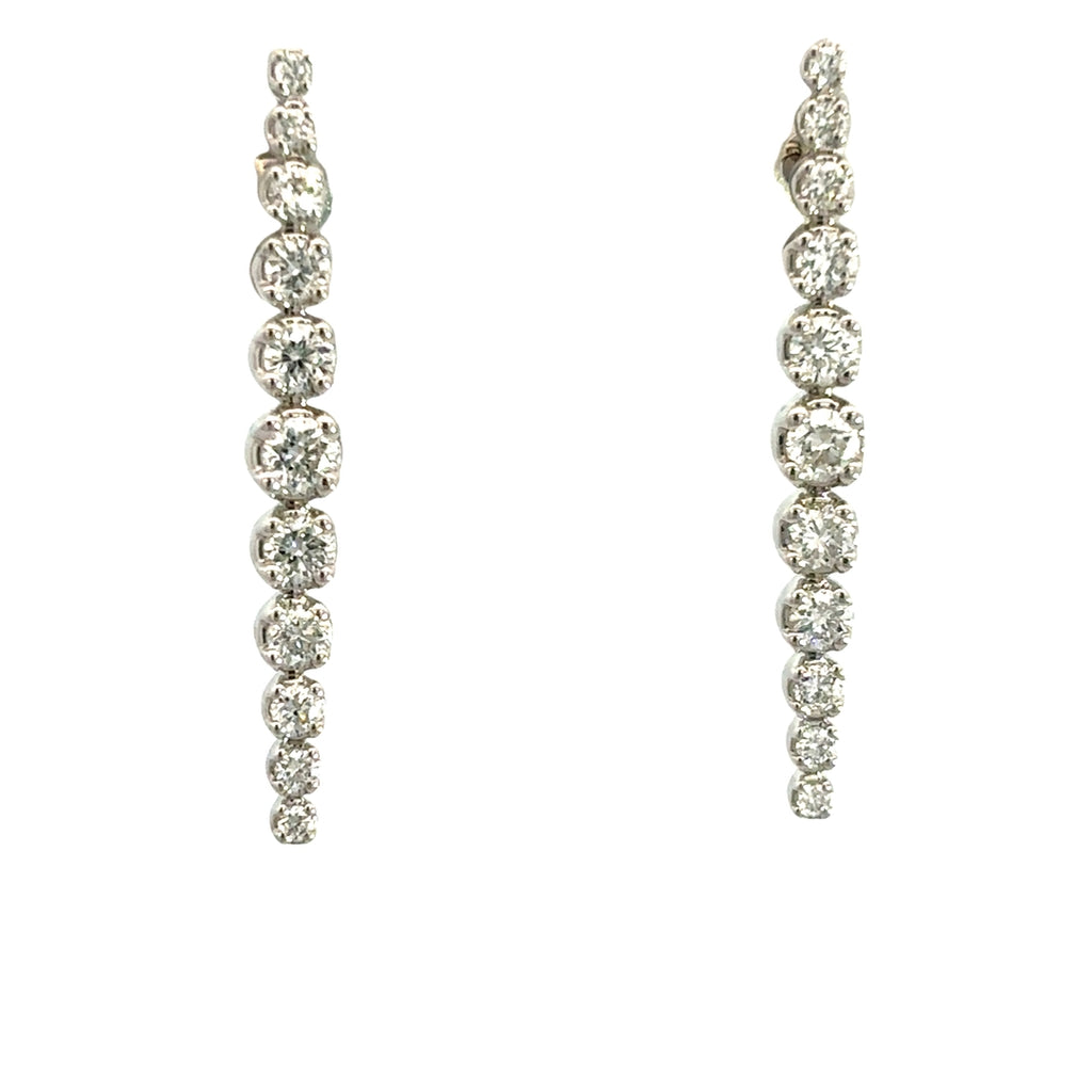 Diamond drop earrings on a white background