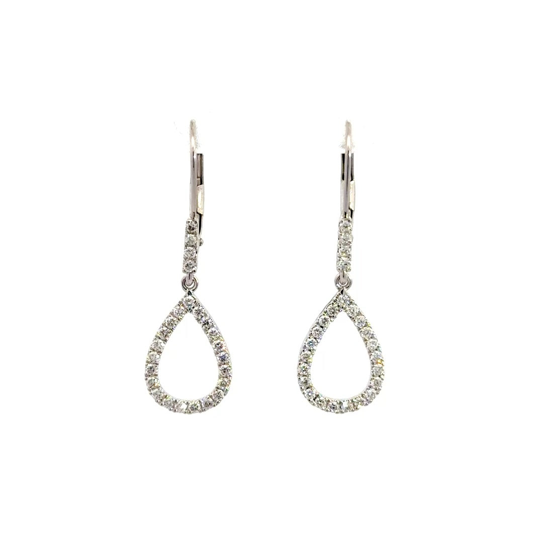 Silver teardrop dangle earrings on a white background