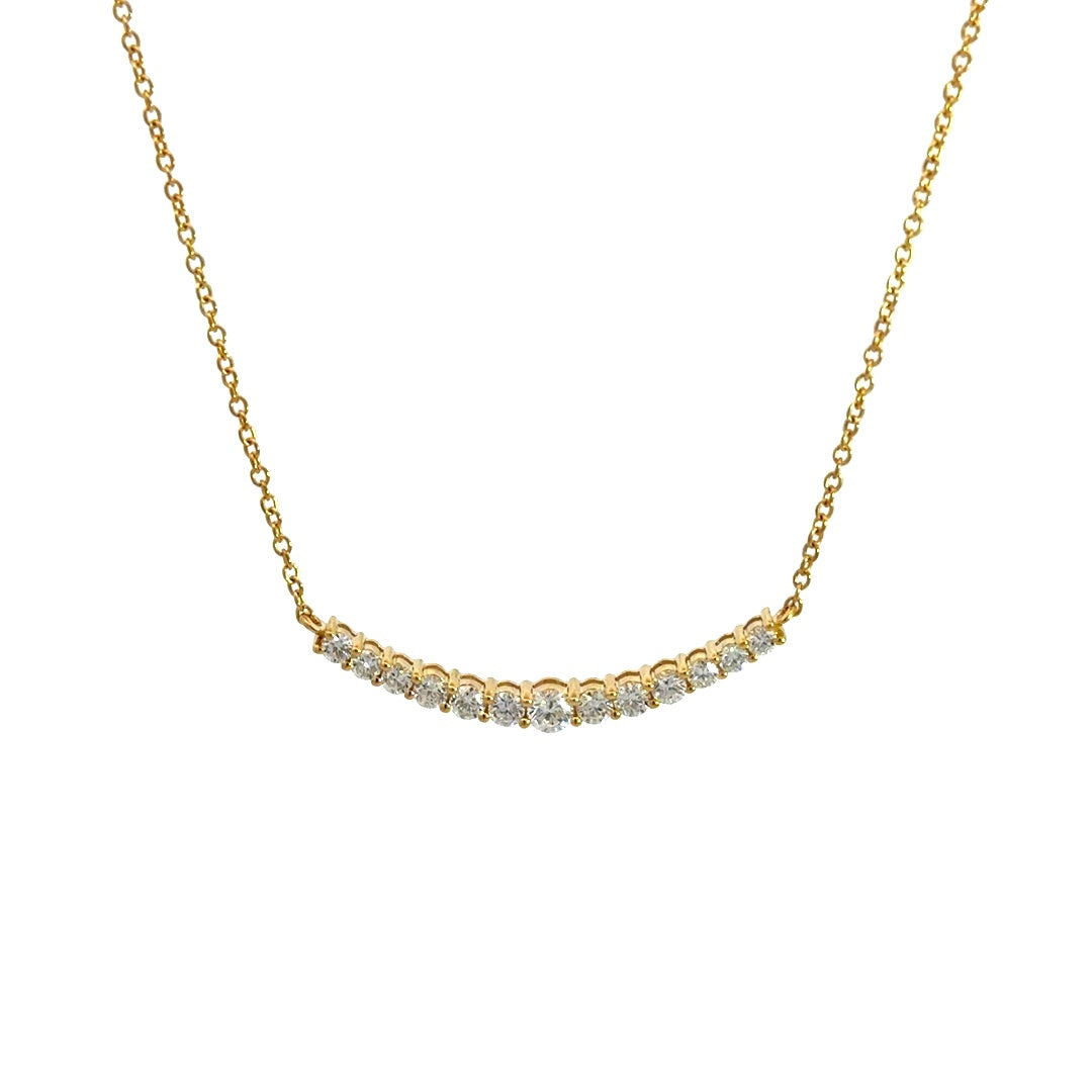 Yellow gold diamond necklace on a white background