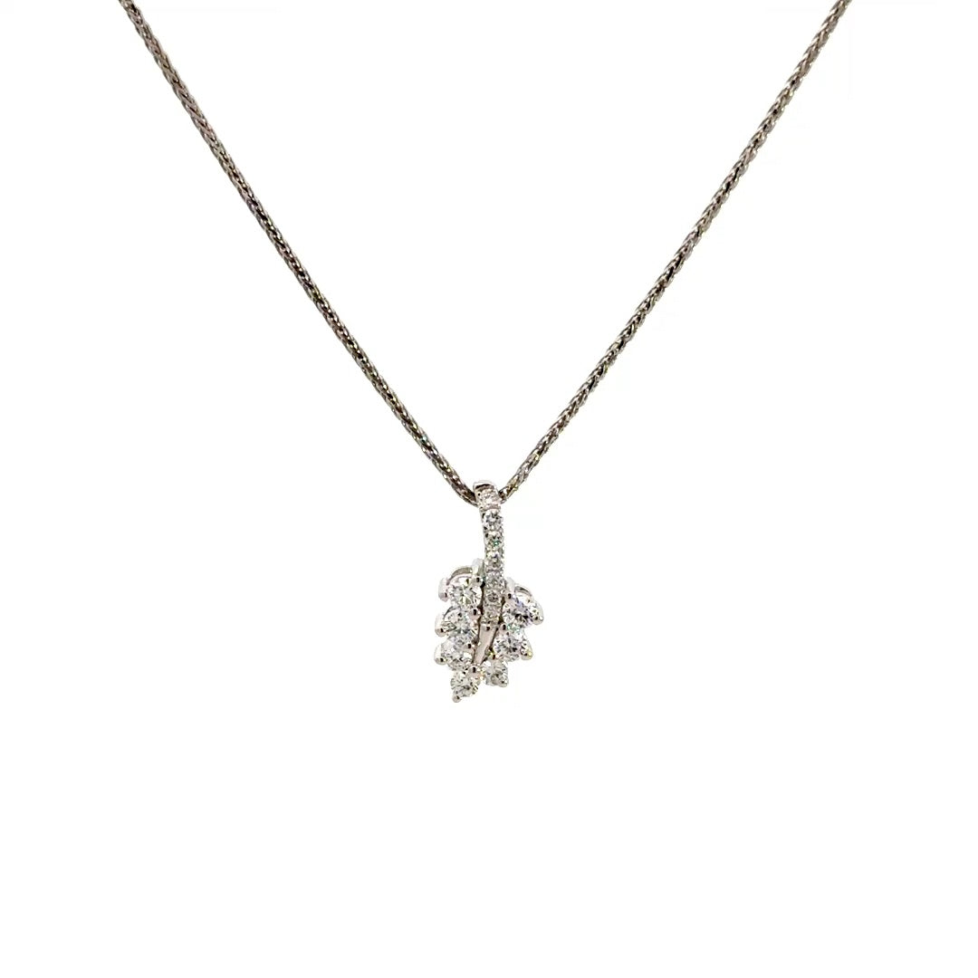 Diamond leaf pendant necklace on a white background