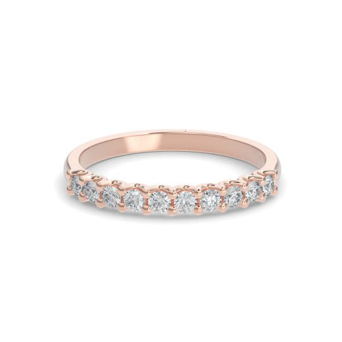 Rose gold wedding band with diamond accent on a white background.