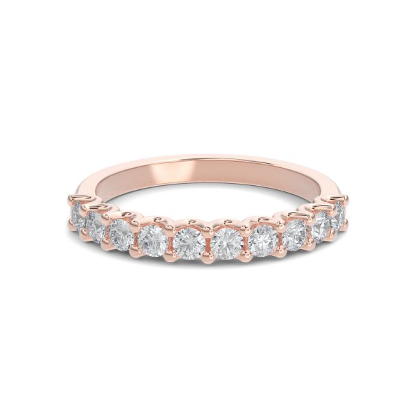 Rose gold wedding band with diamond accent on a white background.