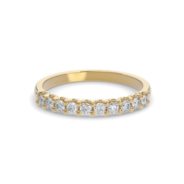 Gold wedding band with diamond accent on a white background.