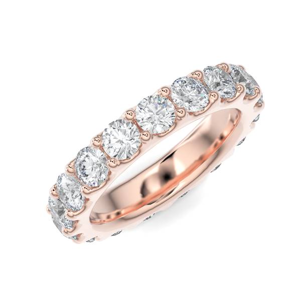 Rose gold wedding band with diamond accent on a white background.