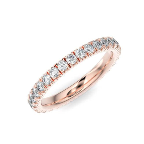 Rose gold wedding band with diamond accents on a white background.