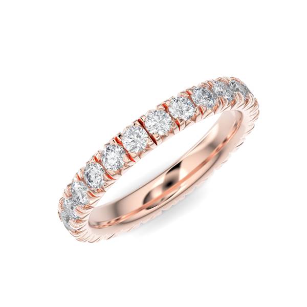 Rose gold wedding band with diamond accents on a white background.