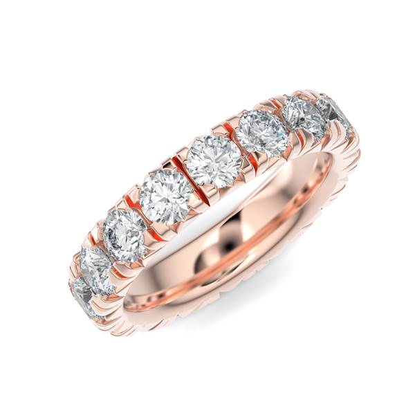 Rose gold wedding band with diamond accents on a white background.