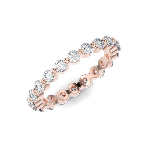 Rose gold wedding band with diamond accents on a white background.